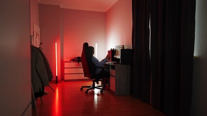 Late night gaming session in a cozy room with ambient lighting