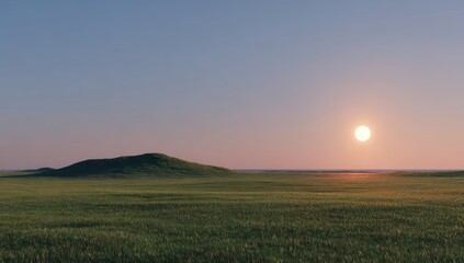 Obraz premium Sunrise over a grassy plain. Lush green field stretches to hazy hills. Soft sunset light