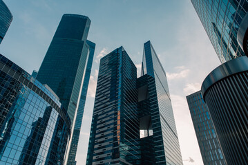 bottom view of the tall skyscrapers of the business district of a modern city