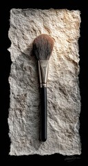 Makeup brush on textured paper