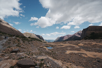 Hiking Trail in Glacier National Park mountain landscape with blue sky
