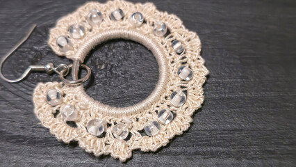 Round green earrings made of thin cotton threads, hand-knitted. Handmade. Jewelry for women.