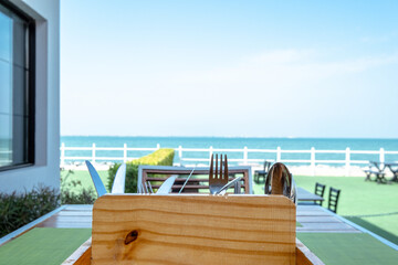 view of the sea from beach restaurant, blue sky with clouds background