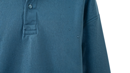 Closeup of blue waterresistant fabric shirt with droplets highlighting waterproof textile technology and modern clothing material