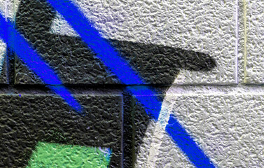 vivid street graffiti texture of colotful spray painting strips on gray metallic brick background, urban culture of modern youth backdrop