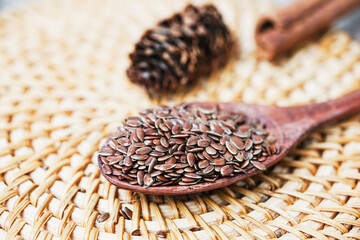 Close up of flaxseed on wooden spoon. Healthy food.