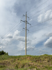 A tall power pole with many wires on it