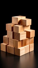 A stack of light-brown wooden blocks against a black background