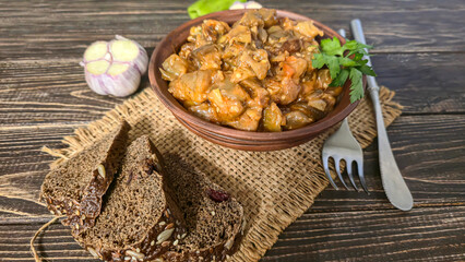 Stew of eggplant, pepper, onion and carrot. Home cooking. In a warm plate,