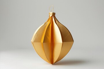Decorative golden lantern hanging gracefully against a plain background showcasing its elegant design and shimmering texture