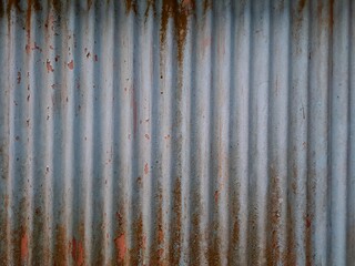 old rusty metal roof texture background. Rusted galvanized iron plate, red stain on old metal sheet wall texture. strip zinc wall background texture.