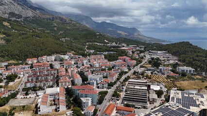 Makarska city town croatia coastal adriatic drone aerial view Dalmatian coast Biokovo mountains