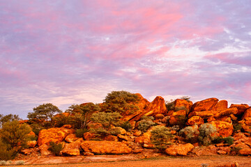 Colourful pink sky over red rocks at Peace Gorge free camp in Meekatharra, Western Australia