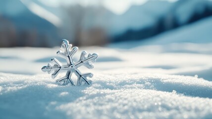 Silver snowflake charm casting long shadow on snow in moonlight.