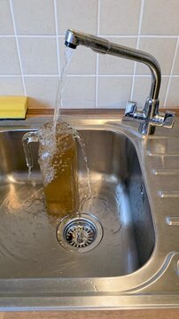 Dirty contaminated water comes from the tap.