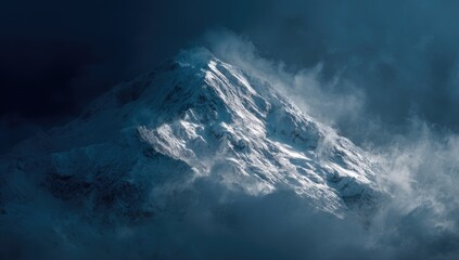Majestic snow-capped mountain peak, shrouded in dramatic clouds
