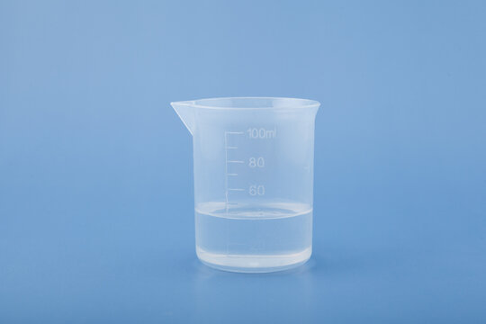 Polydimethylsiloxane PDMS in measuring plastic cup. Food additive E900. Occasionally used to reduce foam during heat processing in food industry. Silicone oil, polymerized siloxane