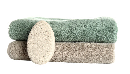 Stack of folded green and beige towels, a pumice stone isolated on solid background Png