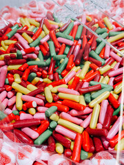 Colorful candy assortment fills a transparent bag for a festive treat experience