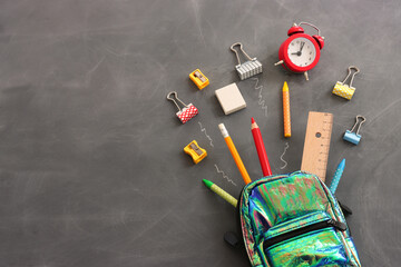 Back to school concept over classroom blackboard. Top view