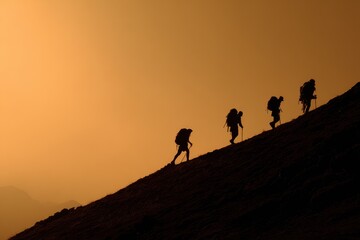 Naklejka premium Uphill Climbing. Silhouettes of Four Unrecognizable Backpackers Trekking Uphill
