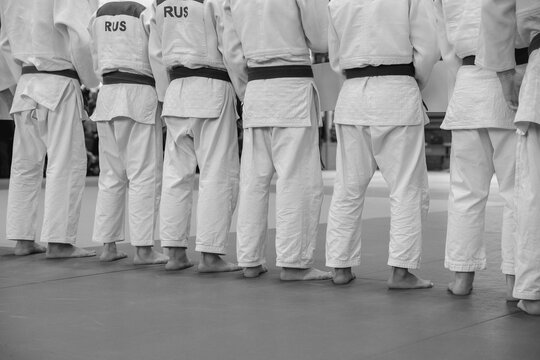judo team in white gi on line before judo competition