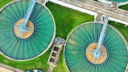 Drone perspective capturing wastewater plant with focus on safety standards, ensuring secure and effective treatment processes that protect communities and ecosystems.
