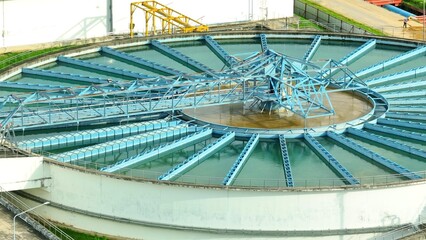 Aerial drone view of wastewater treatment plant showcasing advanced industrial technology and infrastructure, vital for sustainable water management and urban environmental protection.
