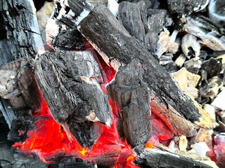 burning charcoal. the wood is smoldering