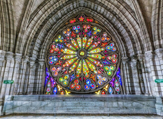 Interior of the Basilica of the National Vow in Neo Gothic style with its colorful stained glass windows.