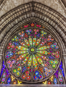 Interior of the Basilica of the National Vow in Neo Gothic style with its colorful stained glass windows.