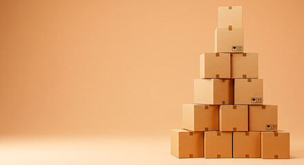 Tall stack of cardboard boxes against a warm peach background