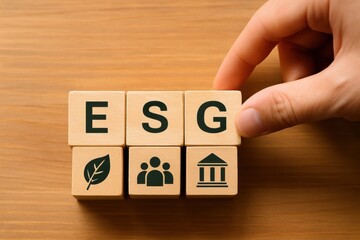 Naklejka premium Conceptual representation of ESG principles with wooden blocks featuring eco-friendly, social, and governance symbols for business and finance topics