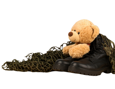 Child’s Teddy Bear Leaning Against Army Boots and Camouflage Netting, PNG Isolated Image