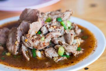 Thai pork neck and herbs salad, is a popular traditional Thai food of Thailand. Spicy Minced Pork Salad is also called Pla Moo.