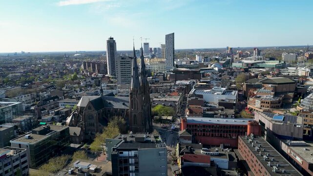 Aerial view of St. Catherine's Church and modern skyscrapers contrasting with the older architecture, creating a dynamic skyline, Eindhoven, North Brabant, Netherlands.