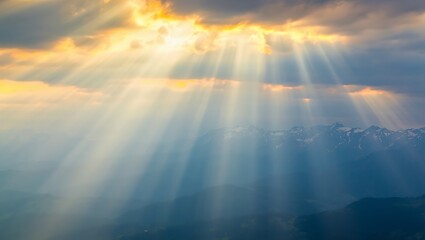 Golden sunbeams pierce through dramatic clouds over a vast expanse of water