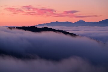 Mountain ridge emerging from a sea of clouds at sunset