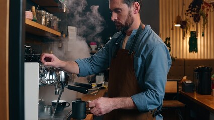 Adult Caucasian small business owner worker waiter barista male prepare order cafeteria catering guy man bartender pour hot espresso stream in mug coffee machine equipment in cafe employee make drink