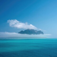 Tranquil island shrouded in mist over turquoise water