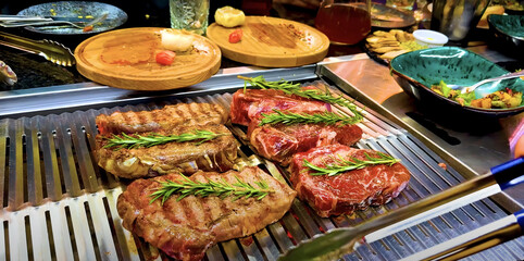 Gourmet Steaks on a Restaurant Grill 