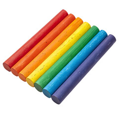 Vibrant rainbow colored chalk sticks arranged diagonally on a black background