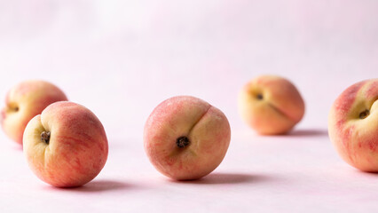 Fresh peaches on pink background, Summer fruit