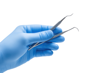 A gloved hand holds dental instruments