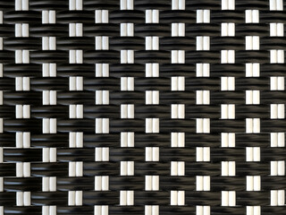 Close up black and white hand woven synthetic rattan texture. Wicker art or rattan weaving art pattern suitable for basket, furniture, outdoor chairs. Seamless background texture.