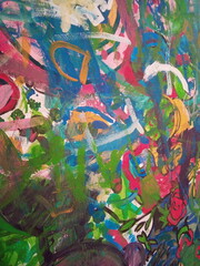 Smearing paint on the wall. Children learn to paint with oil paints. Background for design.