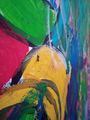 Smearing paint on the wall. Children learn to paint with oil paints. Background for design.