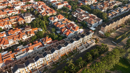 Obraz premium Aerial drone view of densely populated urban neighborhood with narrow streets and compact housing. city planning, social documentaries, and urban development concept