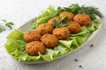 Healthy Vegan Lentil Balls on a Bed of Greens