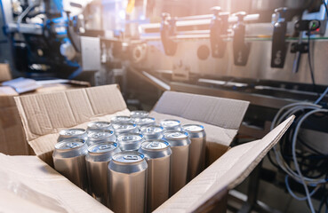 Industrial beer production, aluminum cans in modern brewery conveyor system